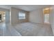 Bright living room featuring carpet flooring with natural light and patio access at 1216 Fox Chapel Dr, Lutz, FL 33549