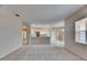 Open concept living room featuring access to the kitchen, creating a modern and airy atmosphere at 1216 Fox Chapel Dr, Lutz, FL 33549