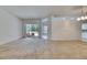 Large living room with sliding glass doors to the screened patio, perfect for indoor-outdoor living at 1216 Fox Chapel Dr, Lutz, FL 33549