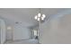 Bright living room with sliding glass doors and contemporary lighting fixture at 1216 Fox Chapel Dr, Lutz, FL 33549