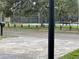 Community tennis courts provide a recreational amenity for active residents with shaded benches for spectators at 12417 N Rome Ave, Tampa, FL 33612
