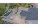 Birds-eye view of a private backyard with gravel landscaping, a shed, covered patio, and a privacy fence at 13916 Briardale Ln, Tampa, FL 33618