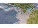 Birds-eye view of a private backyard with gravel landscaping, a shed, covered patio, and a privacy fence at 13916 Briardale Ln, Tampa, FL 33618