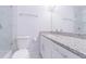 An elegant bathroom featuring sleek granite countertops, chrome fixtures, and a glass enclosed shower at 13916 Briardale Ln, Tampa, FL 33618