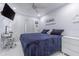 This stylish bedroom has a large bed, TV, and desk space with good natural light at 13916 Briardale Ln, Tampa, FL 33618