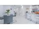Open-concept dining area adjacent to a modern kitchen with granite countertops at 13916 Briardale Ln, Tampa, FL 33618