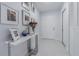 Bright hallway featuring decor, pictures, and clean white doors and trim at 13916 Briardale Ln, Tampa, FL 33618