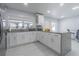 Modern kitchen with stainless steel appliances, granite countertops, and white cabinets at 13916 Briardale Ln, Tampa, FL 33618