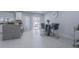 Kitchen featuring granite counters, stainless steel appliances, an island, and sliding doors to the outdoor area at 13916 Briardale Ln, Tampa, FL 33618