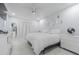 Serene main bedroom featuring light walls, a ceiling fan, light floor and tasteful decor at 13916 Briardale Ln, Tampa, FL 33618