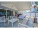 Covered patio has an outdoor kitchen, dining area, heater, and plenty of seating to enjoy the outdoors at 13916 Briardale Ln, Tampa, FL 33618