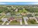 An aerial view of the neighborhood showcasing homes with well-maintained yards and community layout at 15442 Arvin Dr, Brooksville, FL 34604