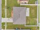 An aerial view of a home showcasing a well-maintained roof and landscaped yard at 15442 Arvin Dr, Brooksville, FL 34604
