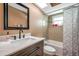 Modern bathroom with a shower-tub combination, vanity, and neutral tile at 15442 Arvin Dr, Brooksville, FL 34604