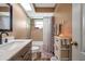 Modern bathroom featuring a shower-tub combination, vanity, and neutral tile at 15442 Arvin Dr, Brooksville, FL 34604