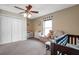Neutral bedroom with a window seat, closet, and ceiling fan at 15442 Arvin Dr, Brooksville, FL 34604