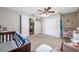 Neutral bedroom with a ceiling fan, closet, and doorway leading to another room at 15442 Arvin Dr, Brooksville, FL 34604