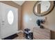 Welcoming entryway featuring a decorative front door, tile flooring, and wall decor at 15442 Arvin Dr, Brooksville, FL 34604