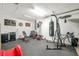 A well-equipped home gym featuring weights, a punching bag, and exercise equipment at 15442 Arvin Dr, Brooksville, FL 34604
