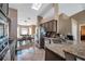 Bright kitchen featuring granite countertops, stainless steel appliances, and tile flooring at 15442 Arvin Dr, Brooksville, FL 34604