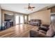 Open-concept living room with hardwood floors, neutral paint, and plenty of natural light at 15442 Arvin Dr, Brooksville, FL 34604