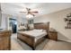 Cozy bedroom featuring a ceiling fan, carpet flooring, and plenty of room for furniture at 15442 Arvin Dr, Brooksville, FL 34604
