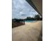 A view of the community swimming pool surrounded by trees and landscaping at 15442 Arvin Dr, Brooksville, FL 34604