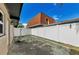 A fenced area of the backyard, with an attached covered area, offering privacy and security at 1800 Mapleleaf Blvd, Oldsmar, FL 34677