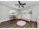Charming Bedroom with hardwood floors, crib, changing table and natural light at 1800 Mapleleaf Blvd, Oldsmar, FL 34677