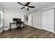 Bedroom with a ceiling fan, closet, and a desk with computer monitors at 1800 Mapleleaf Blvd, Oldsmar, FL 34677