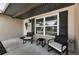 Inviting covered front porch with seating and a decorative wreath on the front door at 1800 Mapleleaf Blvd, Oldsmar, FL 34677