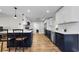 Open concept kitchen and dining area showcases modern finishes and a breakfast bar with stool seating at 1800 Mapleleaf Blvd, Oldsmar, FL 34677