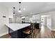 Spacious kitchen with a large island, quartz countertops, and stainless steel appliances at 1800 Mapleleaf Blvd, Oldsmar, FL 34677
