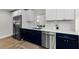Well-appointed kitchen with stainless steel appliances, quartz countertops, and stylish cabinetry at 1800 Mapleleaf Blvd, Oldsmar, FL 34677