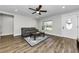 Living room filled with natural light showcases wood floors, modern decor, and a view of the outdoors at 1800 Mapleleaf Blvd, Oldsmar, FL 34677