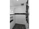 The walk-in shower features custom tile work, multiple jets and a frameless glass enclosure at 1800 Mapleleaf Blvd, Oldsmar, FL 34677