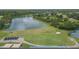 Golf course aerial view features the putting range, lake, and clubhouse at 18136 Nassau Point Dr, Tampa, FL 33647