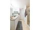 Bright bathroom with a dual sink vanity, glass-enclosed shower, and tile flooring at 18136 Nassau Point Dr, Tampa, FL 33647