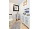 Cozy powder room features a pedestal sink, decorative cabinet, and neutral color scheme at 18136 Nassau Point Dr, Tampa, FL 33647