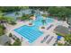 Aerial view of the community pool with various swimming areas and lounge chairs at 18136 Nassau Point Dr, Tampa, FL 33647