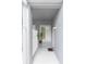 Covered entryway featuring neutral paint, white railing, and a welcoming ambiance at 18136 Nassau Point Dr, Tampa, FL 33647