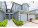 Inviting two-story townhome with a two-car garage and well-manicured landscaping at 18136 Nassau Point Dr, Tampa, FL 33647