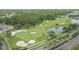 Scenic golf course view with sand traps, green fairways, and a tranquil lake at 18136 Nassau Point Dr, Tampa, FL 33647