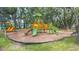 Community playground with slides, climbing structures, and a soft landing surface at 18136 Nassau Point Dr, Tampa, FL 33647