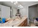 Bathroom vanity featuring double sinks, ample countertop space, and a neutral color scheme at 2349 Willimette Dr, Wesley Chapel, FL 33543