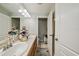 Bathroom vanity featuring double sinks, ample countertop space, and access to the toilet at 2349 Willimette Dr, Wesley Chapel, FL 33543