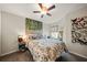 Bedroom featuring wood-style headboard and unique decorations and carpeted floor at 2349 Willimette Dr, Wesley Chapel, FL 33543