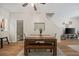 Cozy dining room with modern decor, adjacent to a convenient half-bathroom and staircase at 2349 Willimette Dr, Wesley Chapel, FL 33543
