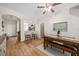 Open-concept dining area, seamlessly connected to the entryway, kitchen, and powder room at 2349 Willimette Dr, Wesley Chapel, FL 33543