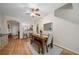 Bright dining room features wood floors, modern decor, and easy access to various parts of the home at 2349 Willimette Dr, Wesley Chapel, FL 33543